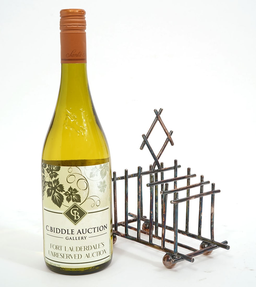 Attrib. Christopher Dresser S/P Toast Rack: Attributed to Dr. Christopher Dresser, silver-plate toast rack measures 7"L x 3.5"W x 7"H. Condition report: Good condition, please examine all photos closely. Contact C. Biddle Auction Gallery for mo