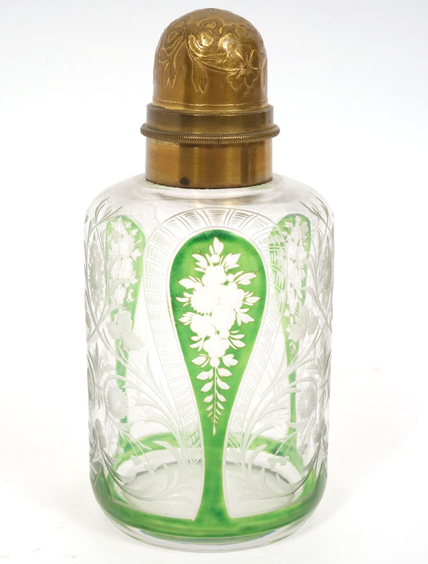 Saint Louis Etched Glass Bottle with Brass Lid: Saint Louis green and clear etched glass bottle with brass top marked 'France' measures 6"H x 2.75"W. Condition report: Common wear for age and use, stopper is missing, please examine all photos close