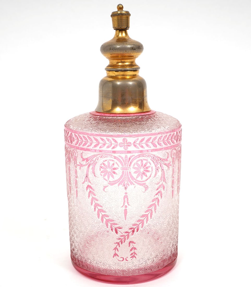 Vintage Perfume Bottle Attributed to Baccarat: Vintage perfume bottle attributed to Baccarat has a gilt metal lid with an acid etched red to clear bottle. It measures 6"H x 2.5"W. Condition report: good condition, please see all photos. Contact C.