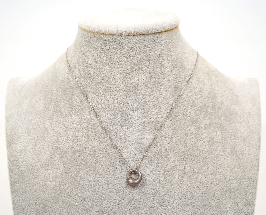 Tiffany & Co P. Picasso Sterling Pendant Necklace: Tiffany & Co Paloma Picasso sterling silver pendant necklace signed on both pendant and chain. Weighs 3.8gr and has a 14" long chain. Condition report: Good condition, please examine all photos