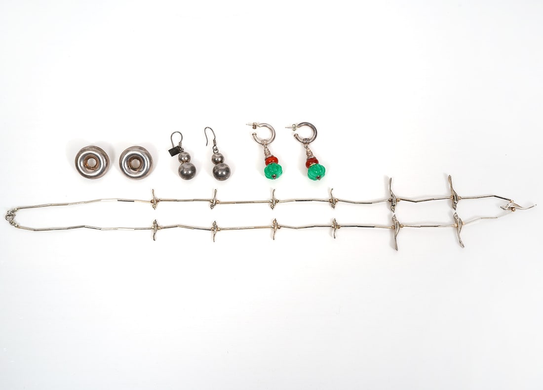 Sterling Silver Earrings & Bird Necklace: Three pairs of sterling silver earrings and a bird necklace includes 2 stacked ball hook earrings (1"); Circle stud earrings (1"); sterling and colored glass earrings (2"); sterling bird necklace (30"