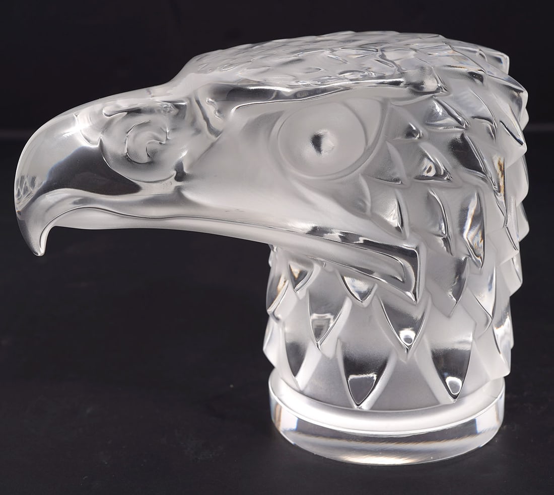 Lalique France Crystal Eagle Head Paperweight: Lalique France crystal eagle head paperweight is signed underside. Measures 5.5"L x 3.5"W x 4.5"H. Condition report: Very minor flea bite chip to end of beak, please examine all photos closely. Contac