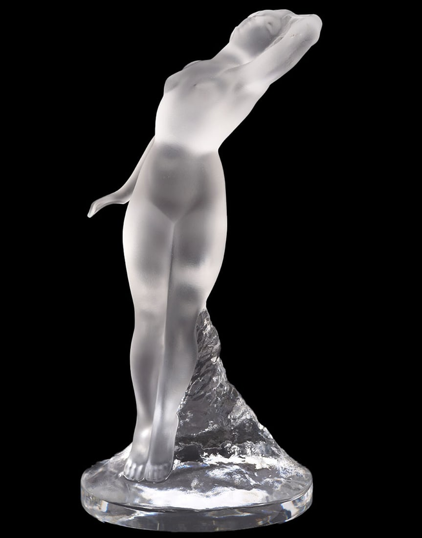 Lalique Art Deco 'Danseur' Nude Crystal Sculpture: Lalique France 'Danseur' nude female crystal scuplture of a woman on a rock formed base, one arm over her head. Signed 'Lalique France' on underside. Measures 9.25"H; 4.5"L x 3"W base. Condition repor