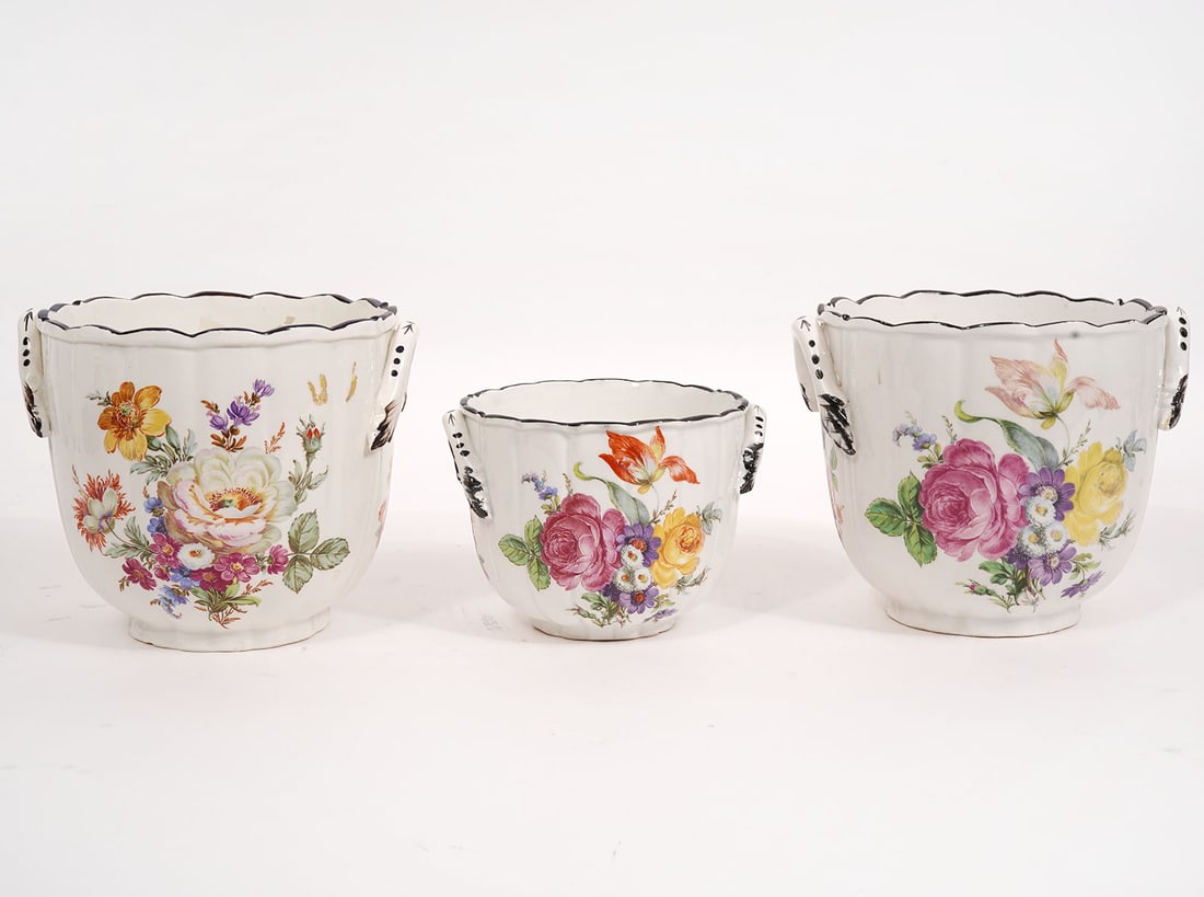 Three Mottahedeh Italian Porcelain Cachepots: Three Mottahedeh Italian porcelain cachepots with applied side handles and scalloped rims, accented with colorful floral designs around the outside. Marked on underside of one 'Italy A Mottahedeh Desi