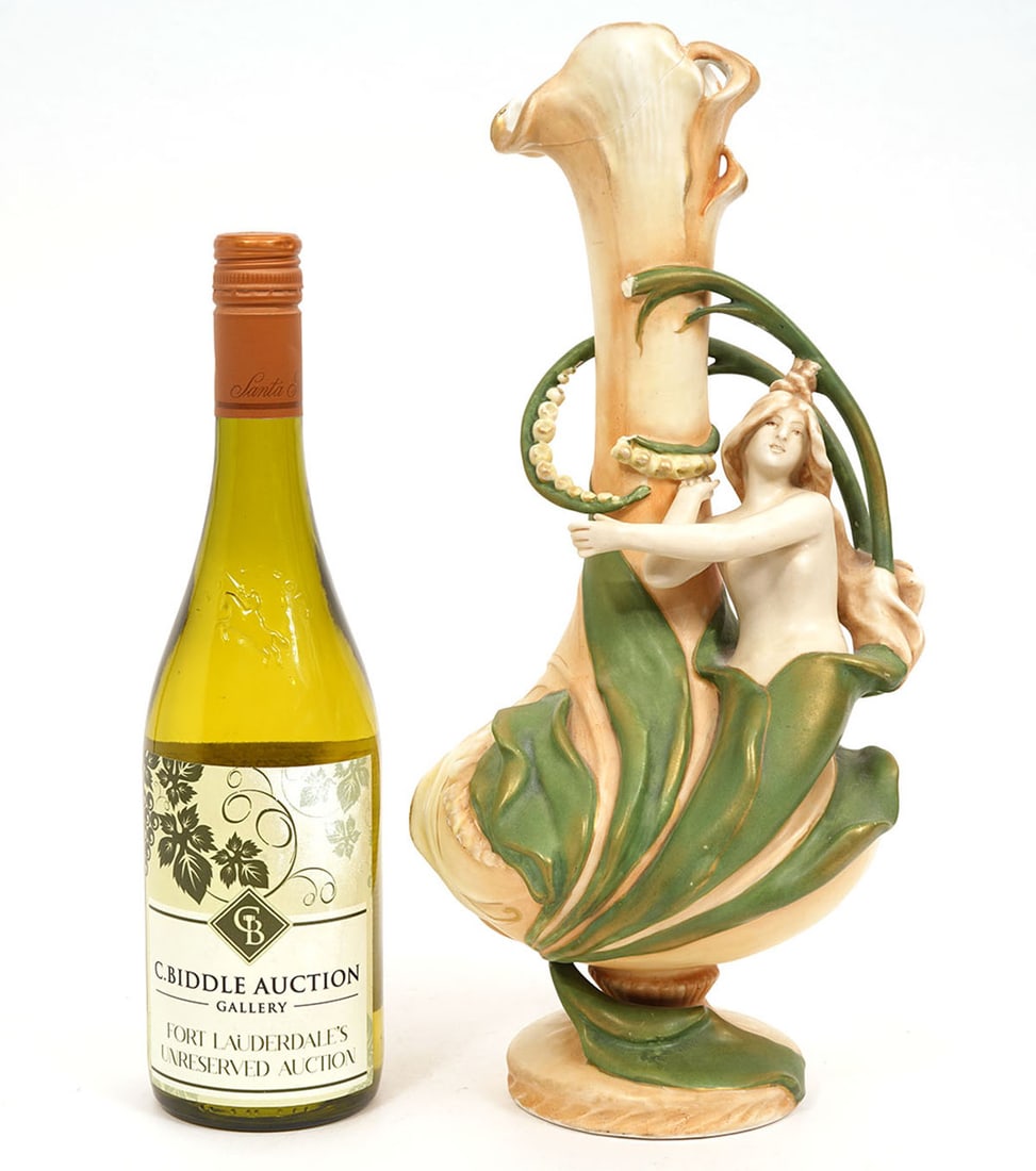 Amphora Art Nouveau Floral Figural Vase: Amphora Art Nouveau figural vase featuring a female emerging from flora. Measures 14.5"H x 6"W. Condition report: Missing pieces and repair to top, please examine all photos closely. Contact C. Biddle