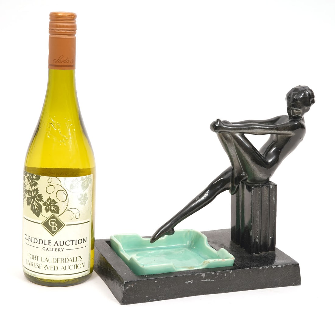 Frankart Art Deco Figural Metal Ceramic Ashtray: Frankart Art Deco cast metal and ceramic ashtray, painted black, featuring figure reclining on plinth. Measures 8.5"L x 5.5"W x 9"H. Condition report: Minor paint losses, please examine all photos clo