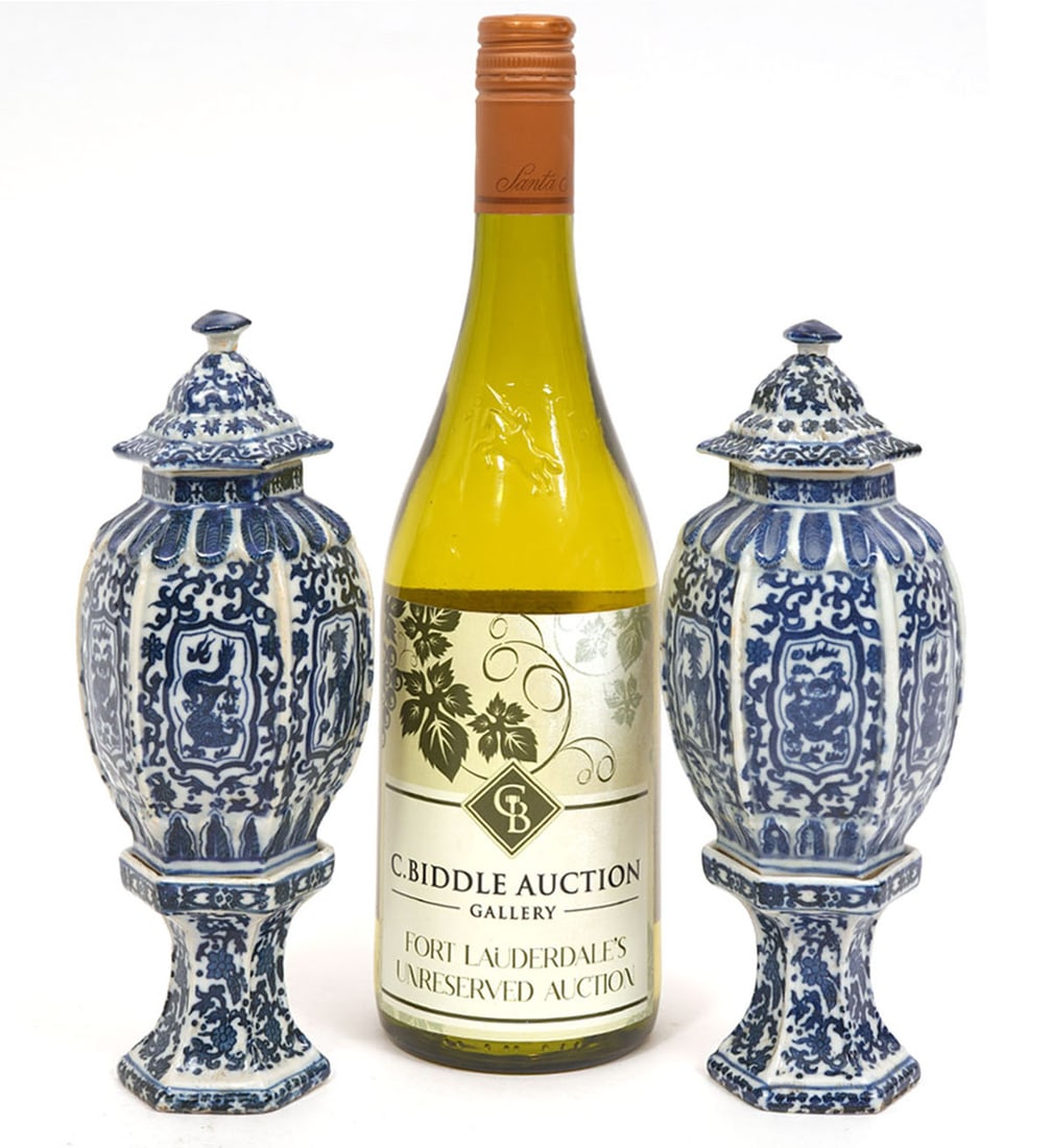 Pair of Lantern-Style Signed Decorative Garnitures: Pair of lantern-style decorative garnitures features blue and white scrolling dragon motif with pedestals. Measures 8.25"H x 3.25"W. Condition report: Good condition, please examine all photos closely