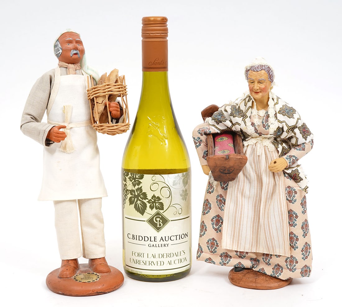 Two Pottery Figures Baker & Grandmother: Two pottery figures, baker (11.5") and grandmother (10"H) holding crib, each with detailed features and costume. Condition report: Good condition, please examine all photos closely. Contact C. Biddle