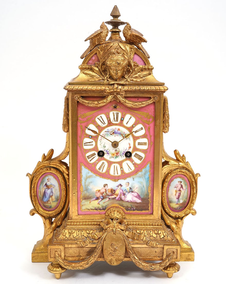 French Sevres-Style Bronze Porcelain Mantle Clock: French Sevres-style gilt bronze porcelain mantle clock features Neo-Classical motif with scrolling leaves and festoon. Pair or doves at top with Greek goddess style face. Hand-Painted porcelain clock