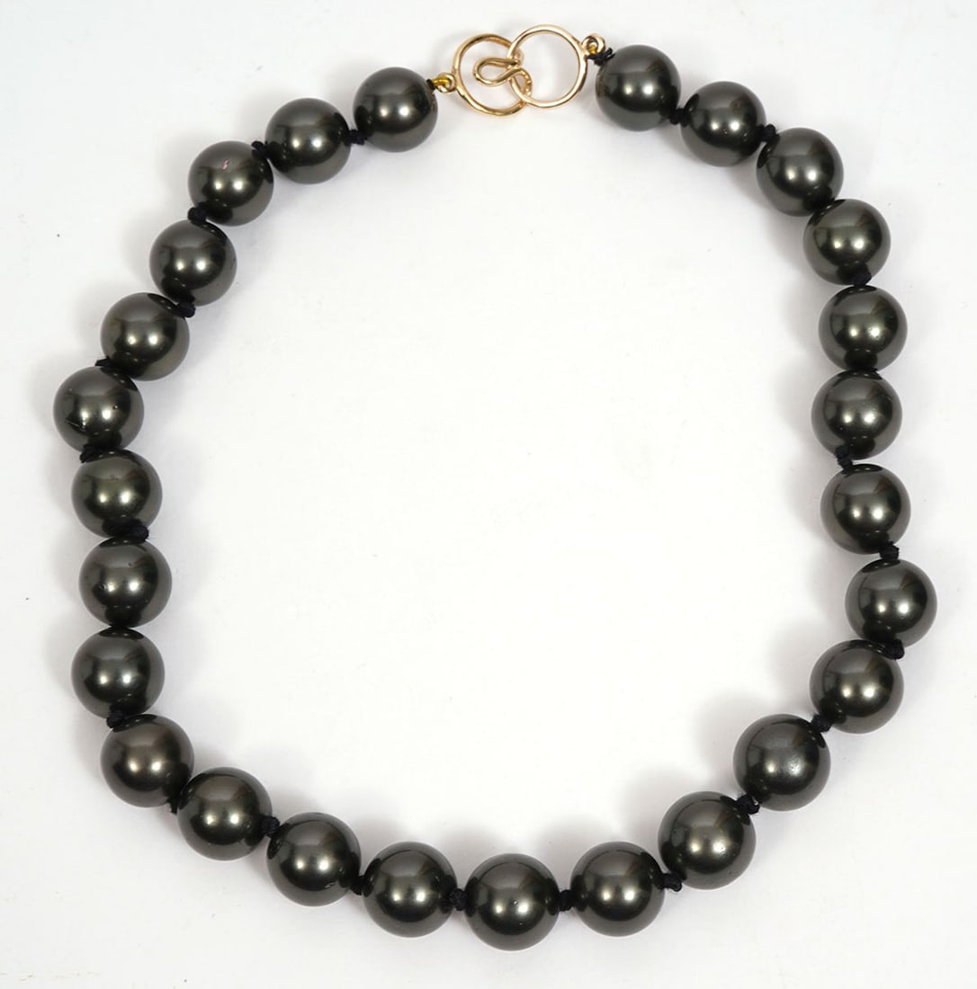 Faux Peacock Pearls 14K YG Clasp Necklace: 14K yellow gold infinity knot-style clasp adorned with a 15" strand of 12.8mm each faux peacock-colored pearls. Condition report: Good condition, please examine all photos closely. Contact C. Biddle A