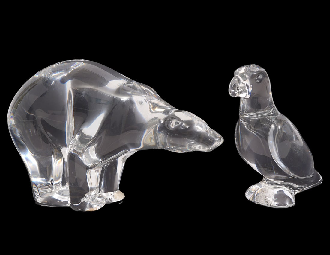 Baccarat Crystal Polar Bear & Parrot Figurines: Baccarat clear crystal polar bear figurine has Baccarat stamp on bottom of front foot. Measures 6.5"L x 4"H x 2.25"W. Clear crystal parrot has Baccarat stamp on underside and measures 4"H x 3.75"L x 1