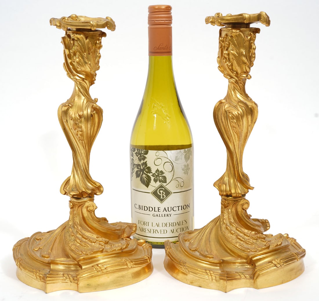 French Louis XV Style Dore Bronze Candelabra: French Louis XV-style dore bronze candelabra features form of scrolling acanthus leaves. Measures 11"H x 6"W. Condition report: Good condition, please examine all photos closely. Contact C. Biddle Auc