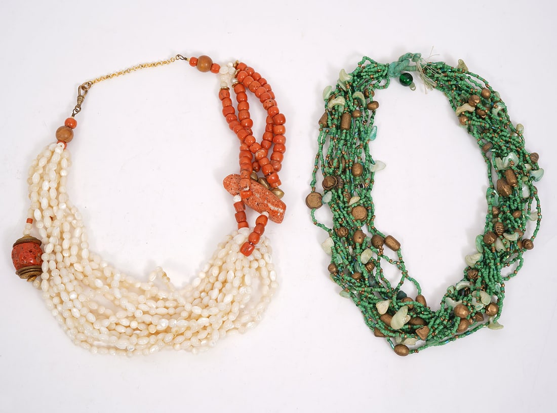 Two Natural Stone MOP and Coral Bead Necklaces: This lot includes two necklaces: One made of coral and mother-of-pearl beads (22"L) and one with green stones and shells multi-strand necklace (20"L). Condition report: Good condition, please examine