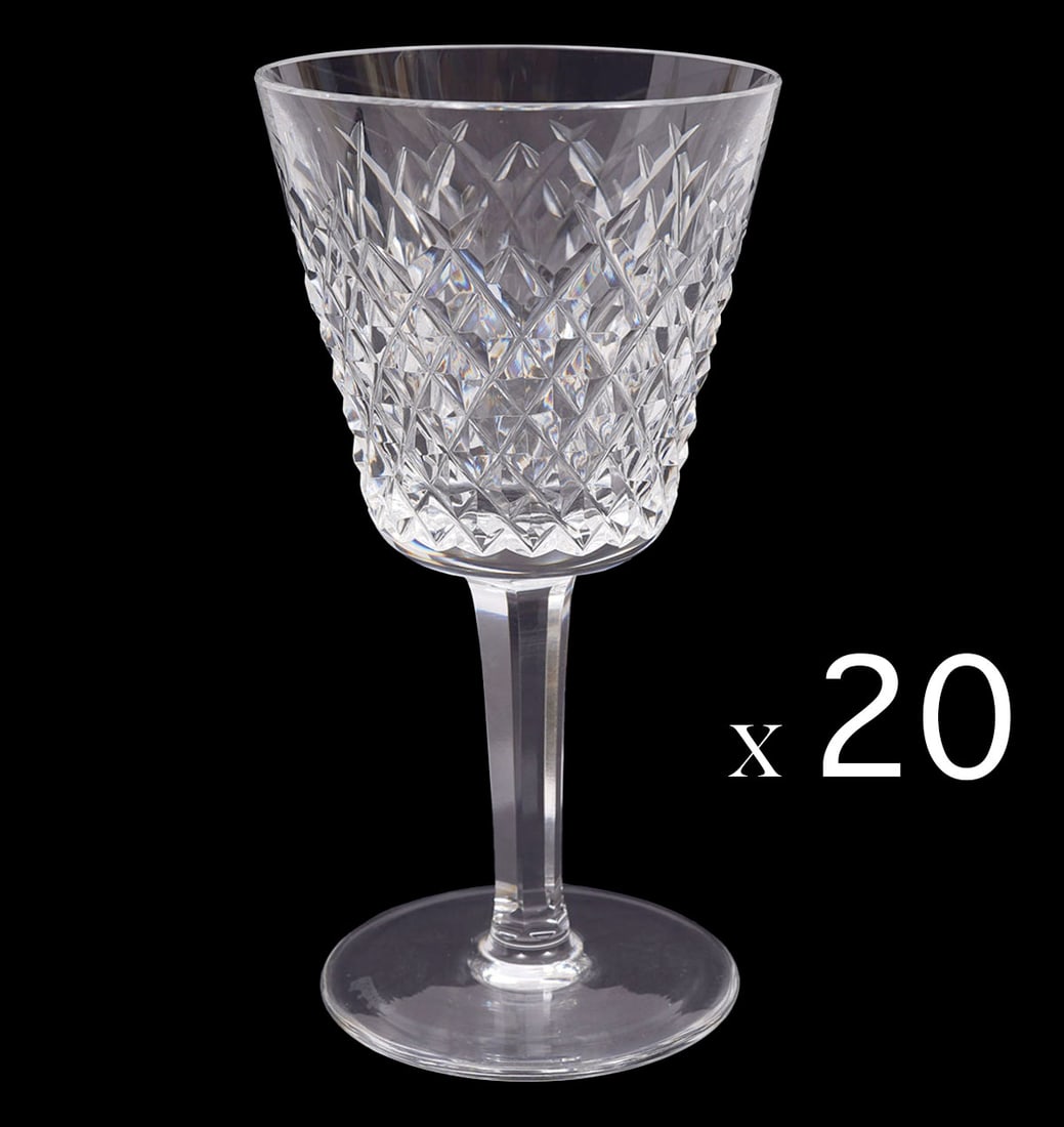 20 Waterford Crystal 'Alana' Claret Wine Glasses: 20 Waterford crystal Claret Wine glasses in 'Alana' pattern with 'Waterford' stamp on underside of each. Measures 5.75"H x 2.5"W base. Condition report: flea bite to top rims of two glasses, please se
