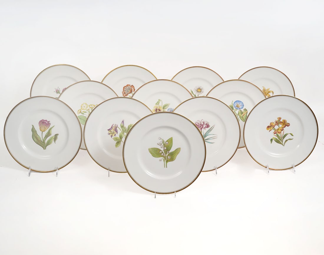 12 Royal Worcester Botanical Cabinet Plates: 12 Royal Worcester porcelain botanical cabinet plates designed by A. H. Williamson have assorted colorful florals in the center, gilt rims and white backgrounds. Measures 10.5"W. Condition report: goo