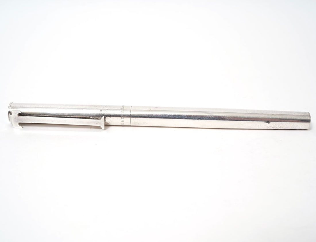 Tiffany & Co. Sterling Silver T-Clip Ballpoint Pen: Tiffany & Company sterling silver T-Clip ballpoint pen marked on top at the base of the T-Clip. Measures 5"L. Condition report: good condition, please see all photos. Contact C. Biddle Auction Gallery