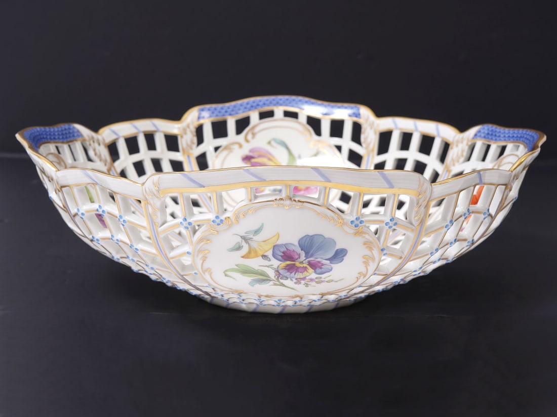 KPM Porcelain Reticulated Bowl: KPM porcelain reticulated bowl features floral motif and scalloped edges. Measures 10.5"W x 3.5"H. Hallmarked on underside. Condition report: Good condition, please examine all photos closely. Contact