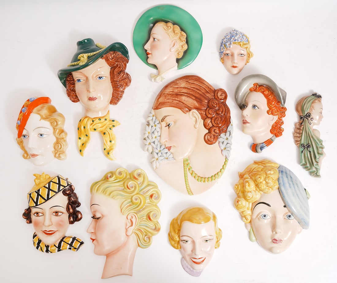11 Ceramic Wall Hangings Featuring Women's Faces: 11 ceramic art deco wall hangings of women's faces includes pieces from Kerman Wien Austria, Erphila Czechlosvakia, W. Goebel Germany, etc. Sizes range from 4.5"H x 3.5"W to 11.25"H x 8.75"W. Conditio
