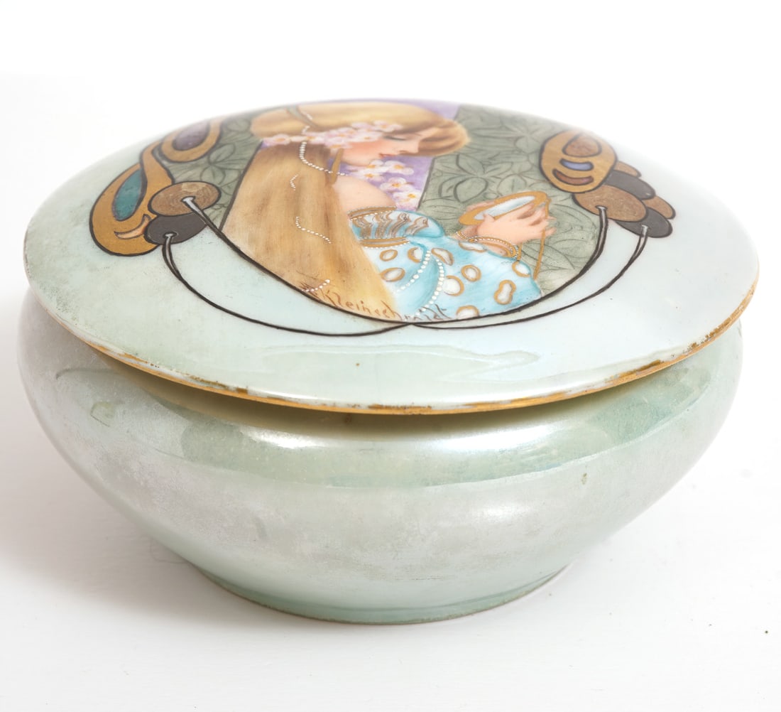 Art Nouveau Porcelain Trinket Box: Art Nouveau porcelain trinket box marked on underside 'Vienna Austria'. Lid is hand painted with stylish woman and interior is gilt. Measures 4 3/8"W x 2 3/8"H. Condition report: good condition, flea 