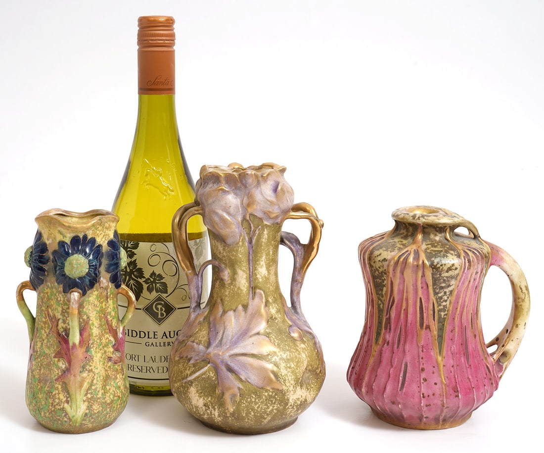 Three Amphora Floral Motif Pottery Vases: Three Amphora Art Nouveau pottery vases, each with floral motif and organic features. Ranging in size from 6"H to 7.5"H. Condition report: Good condition, please examine all photos closely. Contact C.