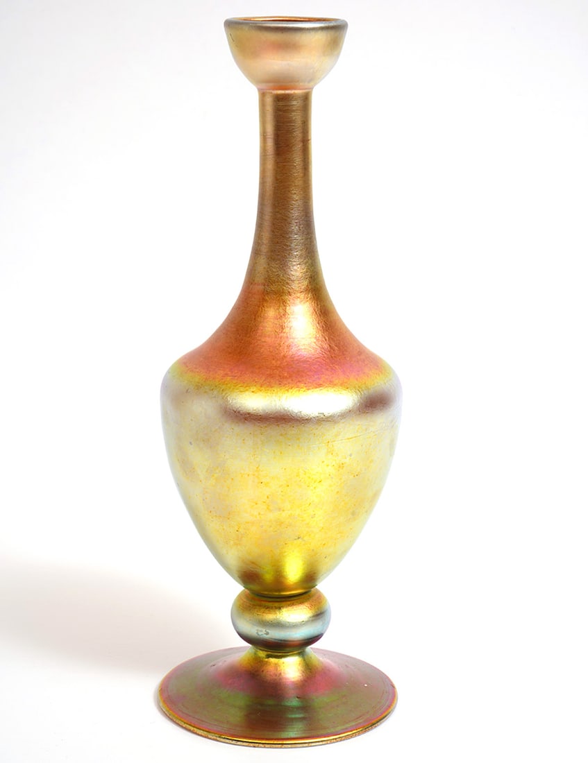 Steuben Aurene Iridescent Art Glass Cologne Bottle: Steuben Aurene gold iridescent art glass cologne bottle is signed on underside. Measures 10.5"H x 3.5"W. Condition report: Good condition, please examine all photos closely. Contact C. Biddle Auction
