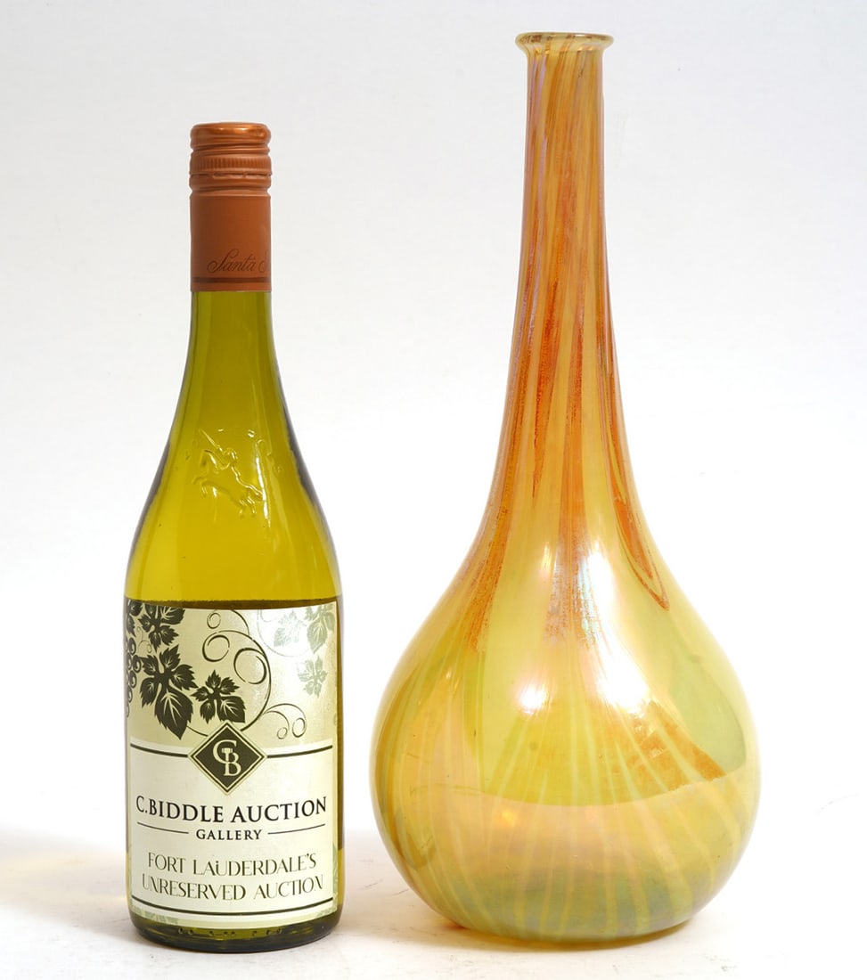 Tiffany Favrile Gourd-Shaped Vase: Tiffany Favrile gourd-shaped vase in yellow and orange with ribbons of red. Signed with paper label. Measures 13"H x 5.5"W. Condition report: Good condition, please examine all photos closely.