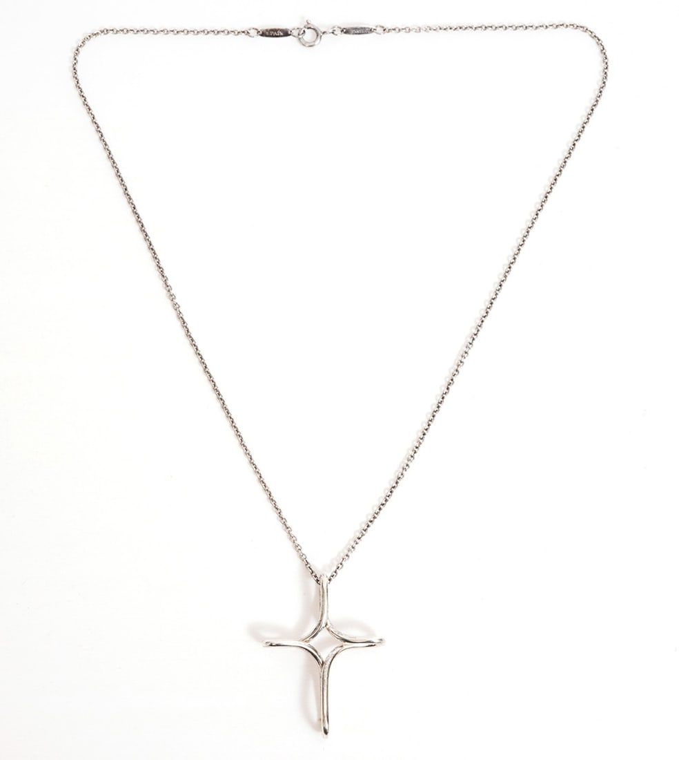 Elsa Peretti Tiffany & Co Infinity Cross Necklace: Elsa Peretti for Tiffany & Co, sterling silver Infinity Cross pendant necklace has a 16" long chain and a 1.5" long pendant. Weight - 5.6g. Condition report: Good condition, please examine all photos
