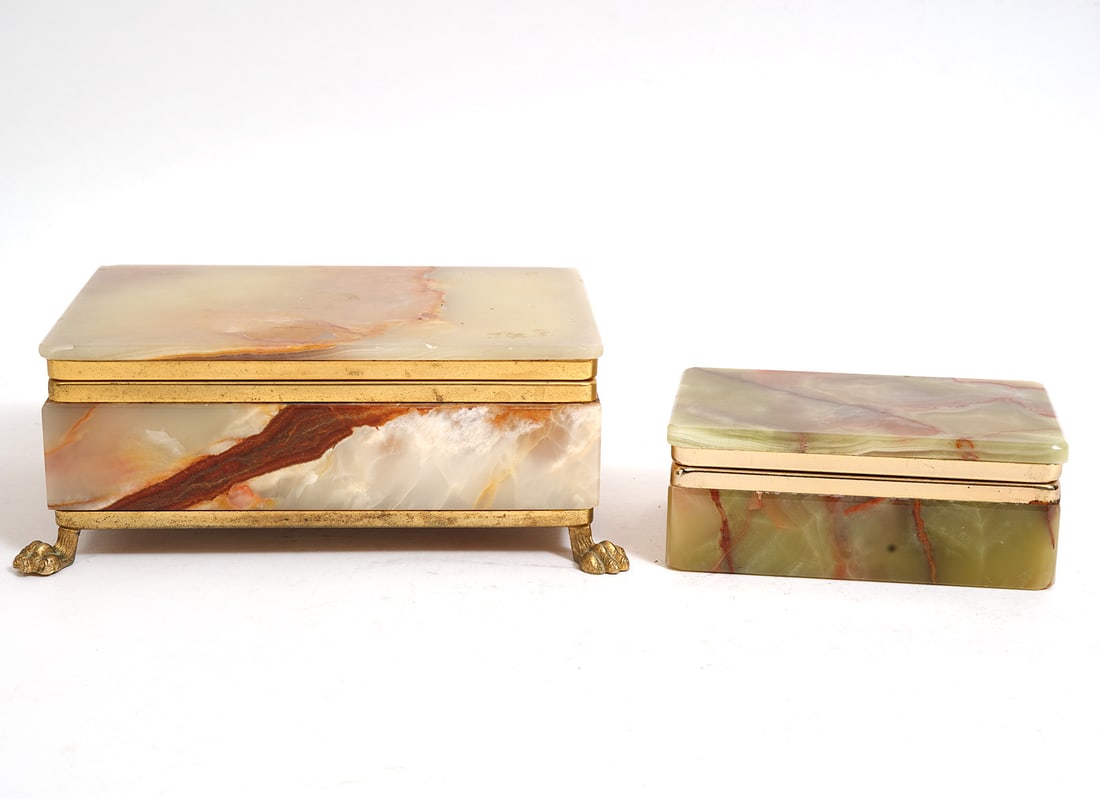 Two Green Onyx Bronze Mounted Boxes: Two green onyx bronze mounted boxes includes: Smaller (4.25"L x 2.5"W x 1.75"H); Larger, red fabric lined with claw feet (6.5"L x 4.5"W x 2.5"H). Condition report: Larger box has minor chips to edges 