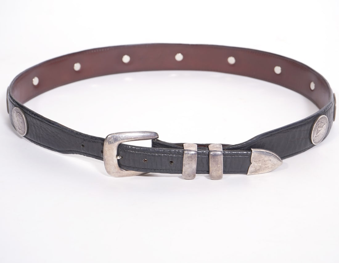 Douglas Mangus Sterling & African Bison Belt: Douglas Mangus brown African Bison leather belt with sterling buckle and accented with 11 coins. Marked on underside '37' and Douglas Mangus Sterling on buckle. Condition report: good used condition, 