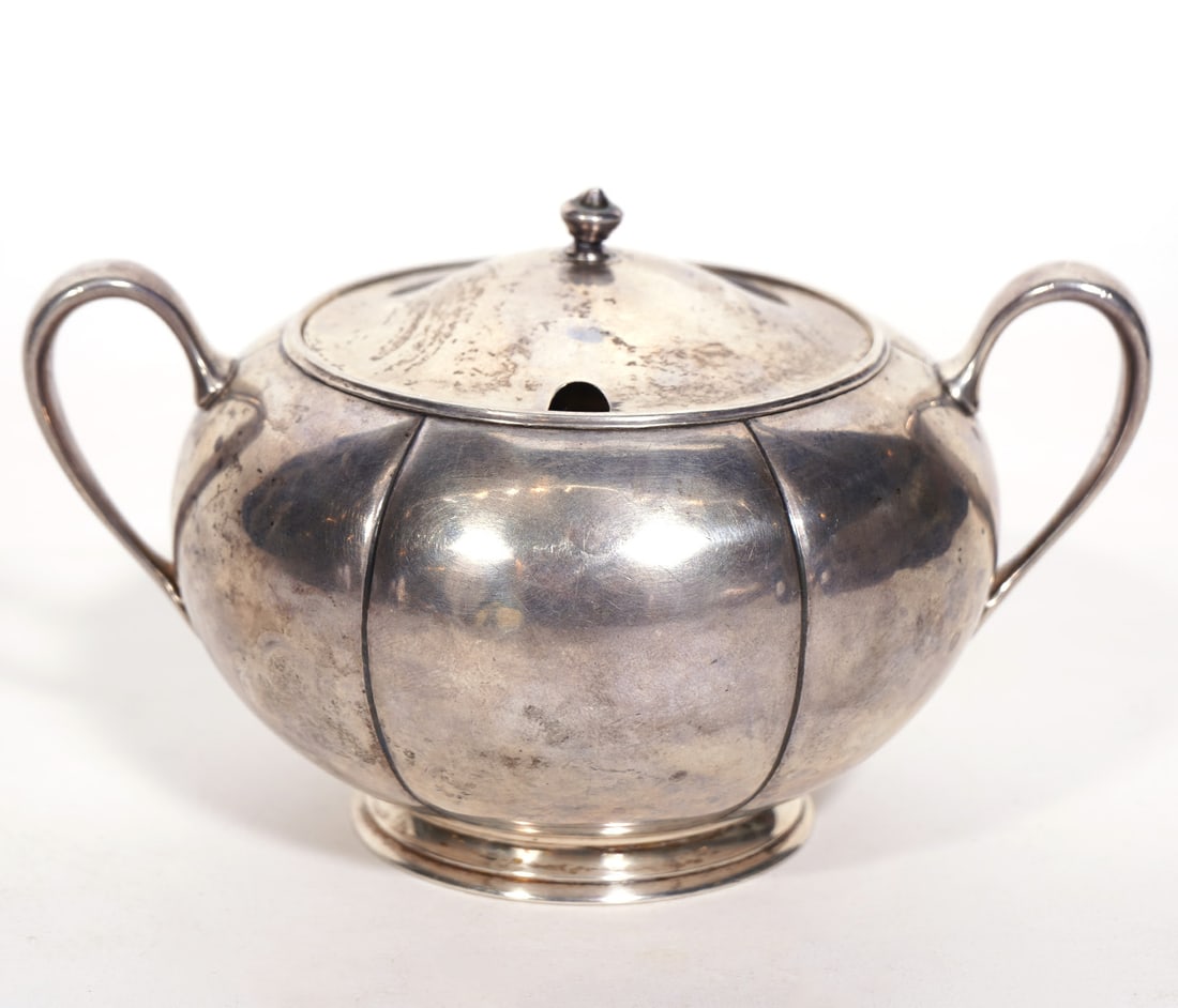 Arthur Stone Sterling Silver Sugar Bowl: Arthur Stone sterling silver sugar bowl, circa 1920. Hallmarked underside. Weight - 249.5g. Measures 3.5"H x 6"W. Condition report: Very minor bend to finial, please examine all photos closely. Contac