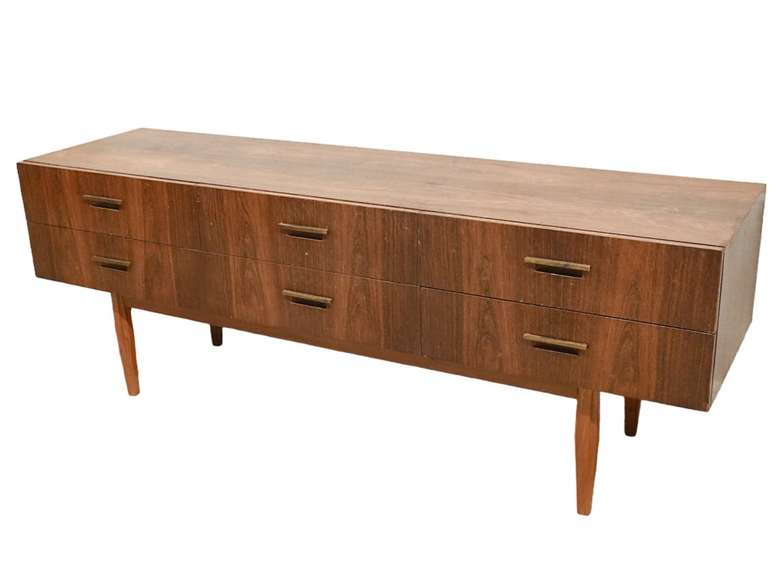Mid Century Modern Walnut Credenza: Mid century modern walnut credenza is raised on 4 tapered legs and has 9 drawers. Measures 64.75"L x 17.5"D x 23.75"H. Condition report: good condition, top is a little discolored, please see all phot