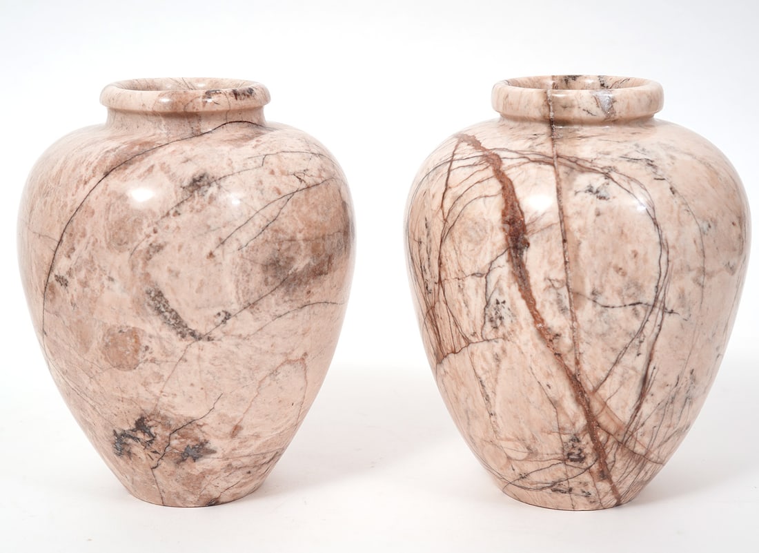 Pair of Pink Veined Marble Vases: Pair of pink veined marble vases, each measures 6.5"H x 5"W. Condition report: Good condition, please examine all photos closely. Contact C. Biddle Auction Gallery for more detailed information. C. Bi