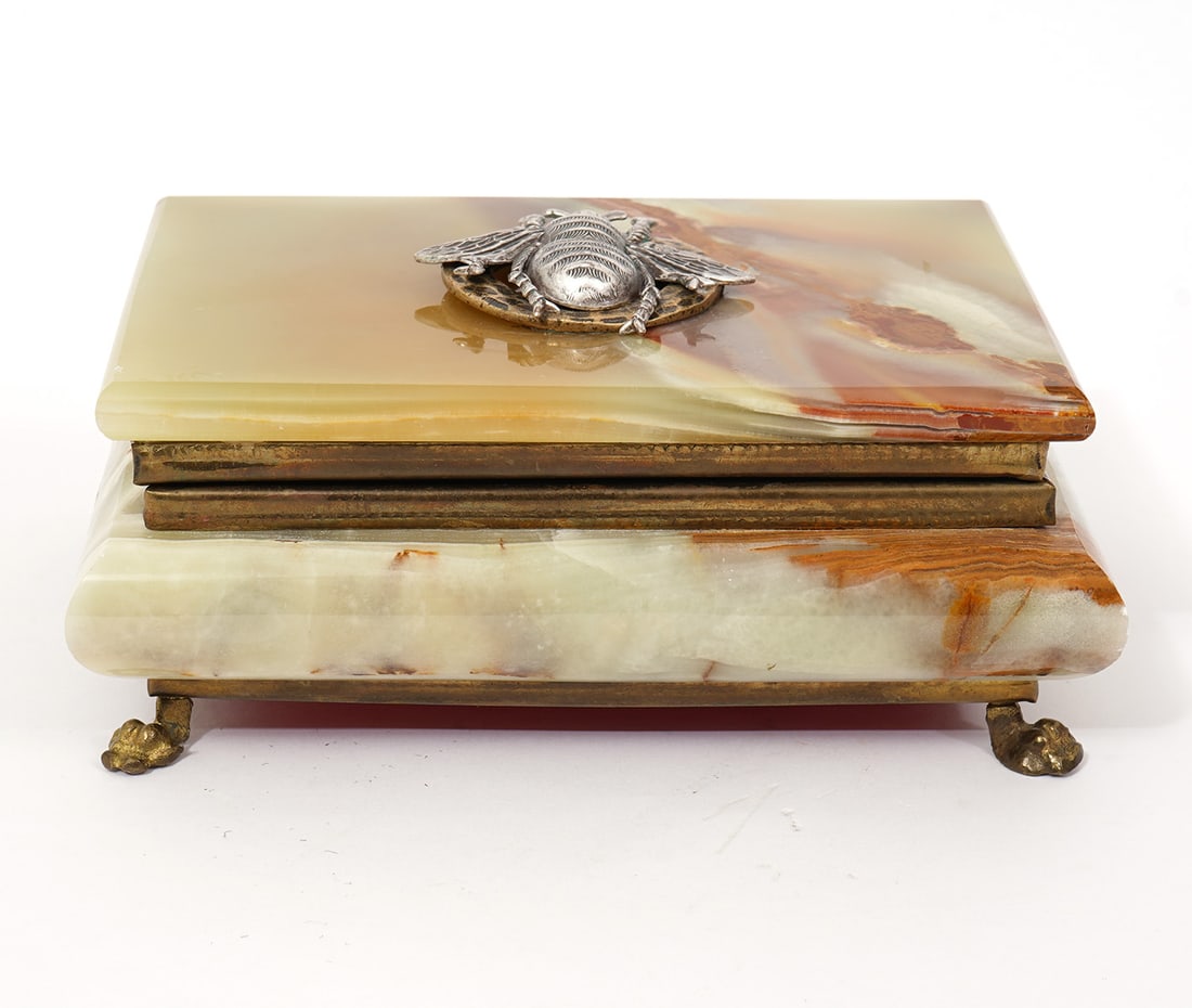 Green Onyx Footed Jewelry Box with Bee Medallion: Green onyx footed jewelry box with applied bee medallion on top and red velvet interior. Measures 7"L x 5"W x 3"H. Condition report: Minor flea bites to edges, please examine all photos closely. Conta
