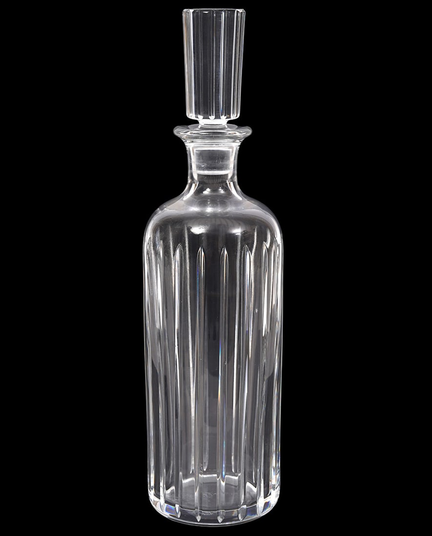 Baccarat Crystal Harmonie Whiskey Decanter: Baccarat Crystal "Harmonie" whiskey decanter, features vertical cuts all around. Acid etched mark underside. Measures 12.5"H x 3.5"W. Condition report: Good condition, please examine all photos closel