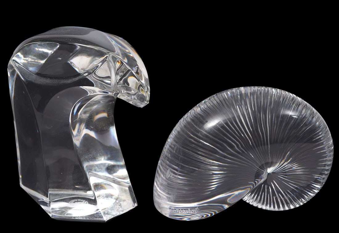 St. Louis Falcon & Baccarat Shell: Crystal lot includes a Saint Louis crystal falcon paperweight (3.5"H x 3.5"W) and a Baccarat crystal shell (3"H x 3.5"W). Condition report: Good condition, please examine all photos closely. Contact C