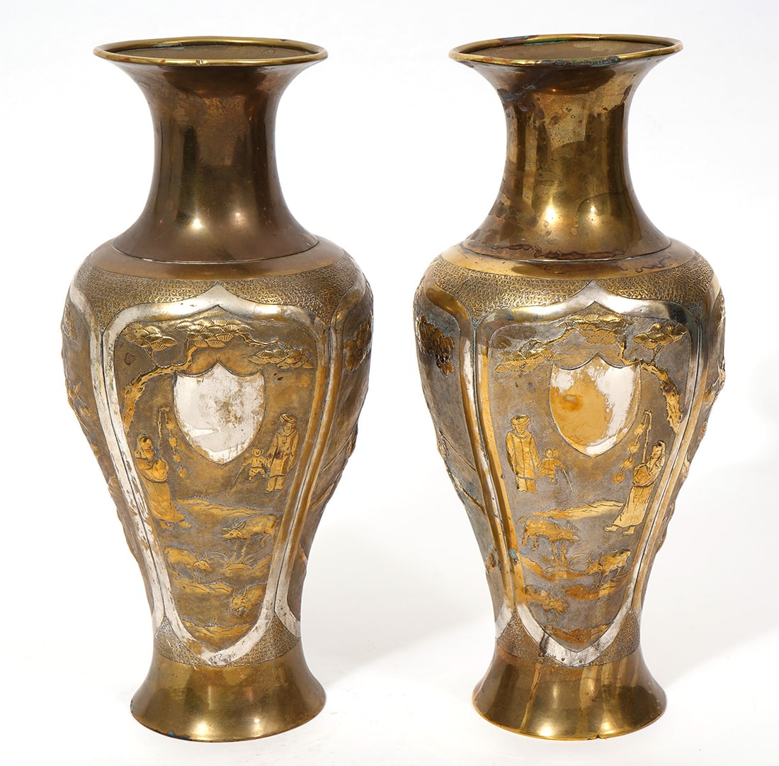 Pr. Vintage Japanese Vases: Pair of vintage Japanese gilt vases with silver overlay features 5 panels with landscape and figural scenes. Measures 11.75"H x 5"W. Condition report: surface wear commensurate with age and use, pleas