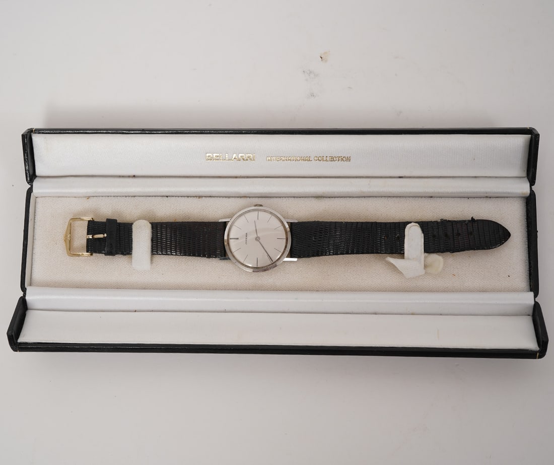 Juvenia Quartz Watch with Lizard Skin Band: Juvenia quartz watch with black lizard skin band, case measures 34mm. Condition report: Good condition, please examine all photos closely. Contact C. Biddle Auction Gallery for more detailed
