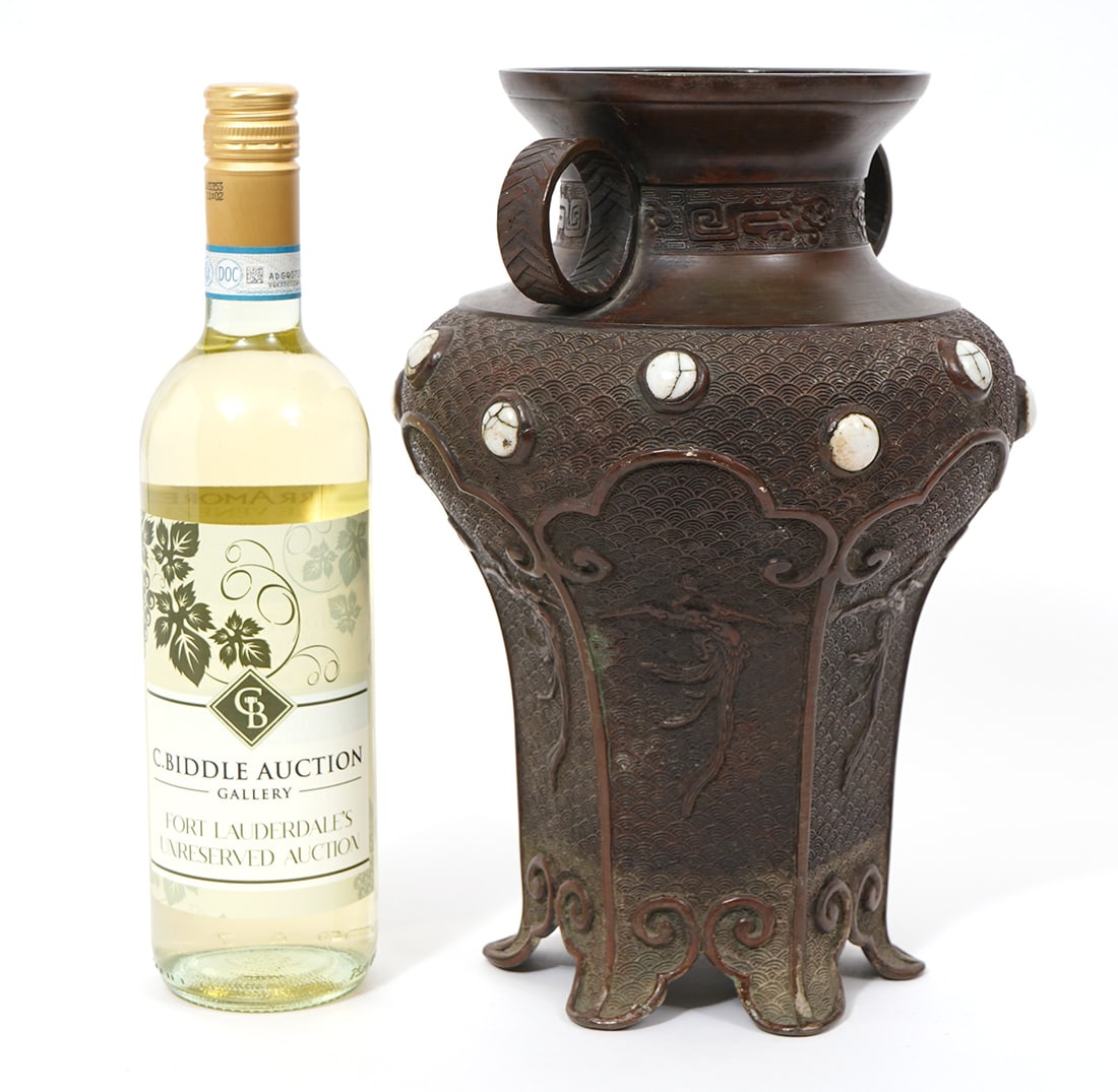 Japanese Bronze Vase With White Stone Cabochons: Japanese bronze vase with white stone cabochons, decorated with fan-style pattern and birds in relief. It has circular double handles and is signed underside. Measures 12"H x 8"W. Condition report:
