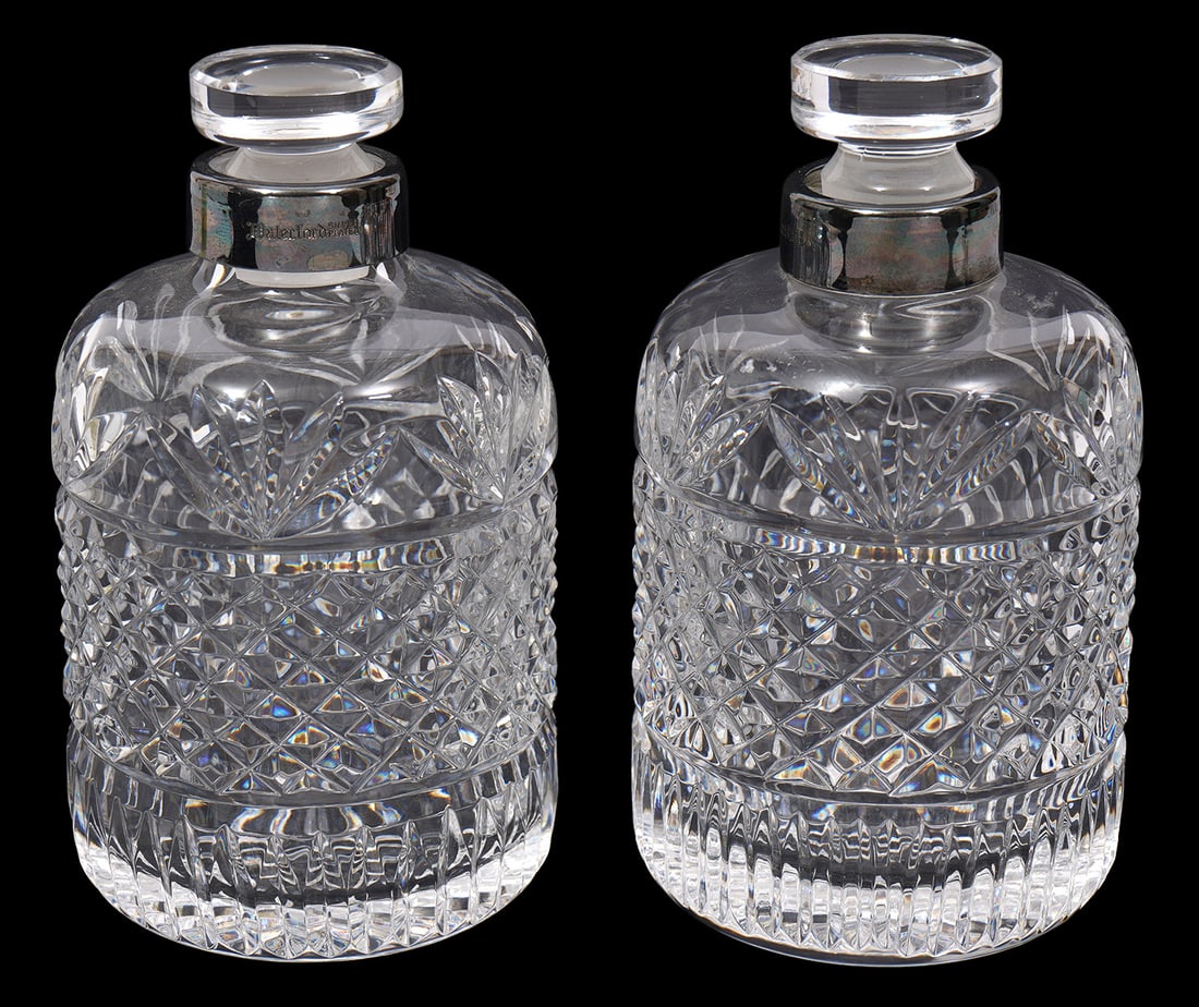 Two Waterford Crystal Silver-Plate Collar Bottles: Two Waterford crystal silver-plate collar dresser bottles features diamond cut and fan patterns. Each measures 4.5"H x 2.5"W. Condition report: Good condition, please examine all photos closely. Conta