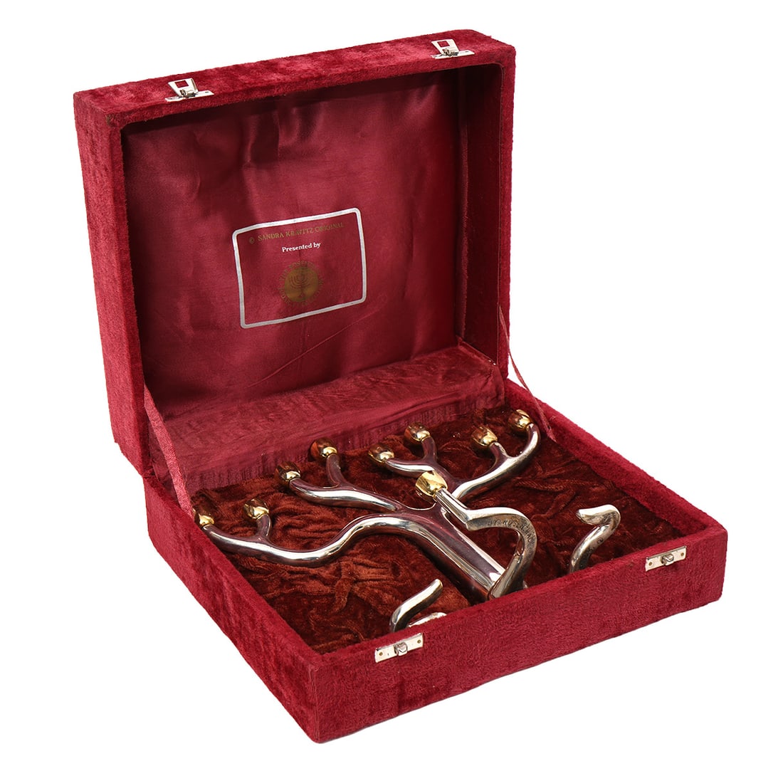 Judaica Sandra Kravitz for Rosenthal Menorah: Judaica Sandra Kravitz for Rosenthal, Tree-of-Life style mixed metal menorah in original fitted box. Marked underside "By Rosenthal Sandra Kravitz," Measures approximately "8.75"H x 11"W. Condition re