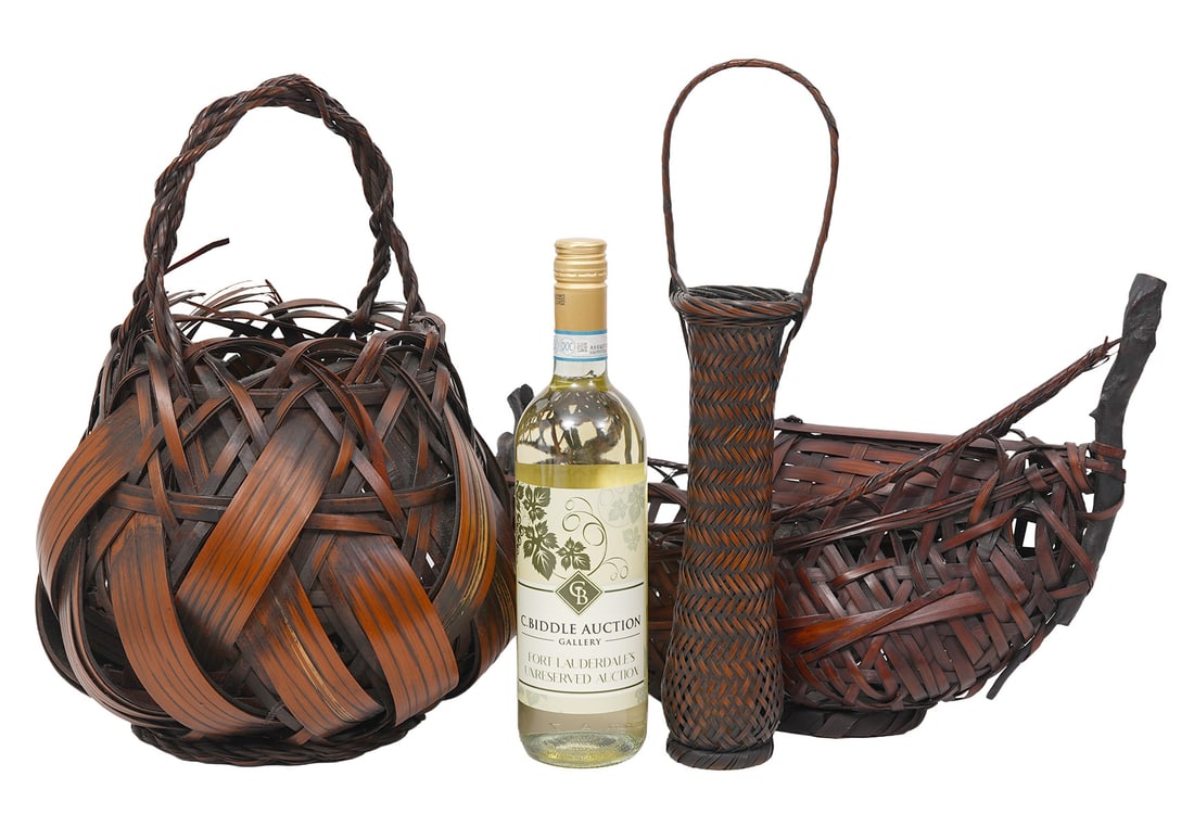 Three Japanese Artisanal Woven Bamboo Baskets: Three Japanese Artisanal woven smoked bamboo baskets includes a Boat-form Ikebana flower basket (11"H x 15"W); round swirling motion basket with twist handle (15"H x 10"W ); Slender zig-zag plaiting w