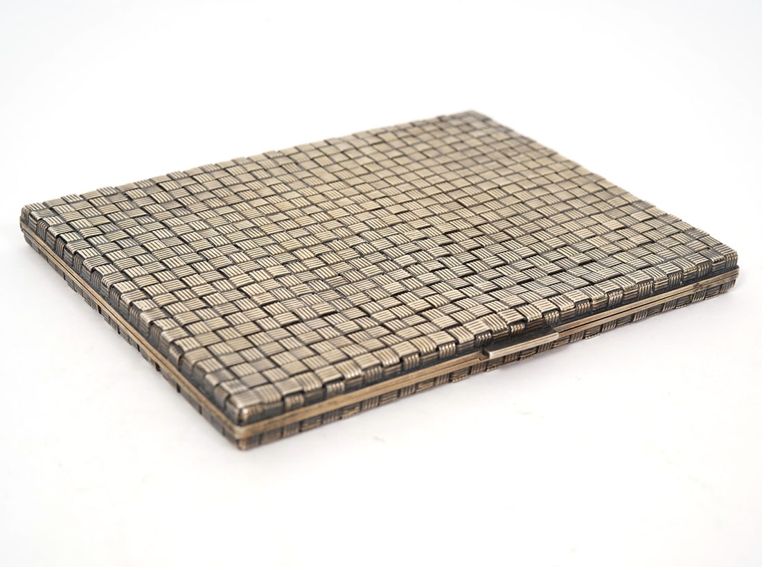 Tiffany & Co Sterling Basketweave Cigarette Case: Tiffany & Co sterling silver basketweave style cigarette case, stamped inside. Measures 4.75"L x 3.75"W. Weight - 190.3g. Condition report: Good condition, please examine all photos closely. Contact C