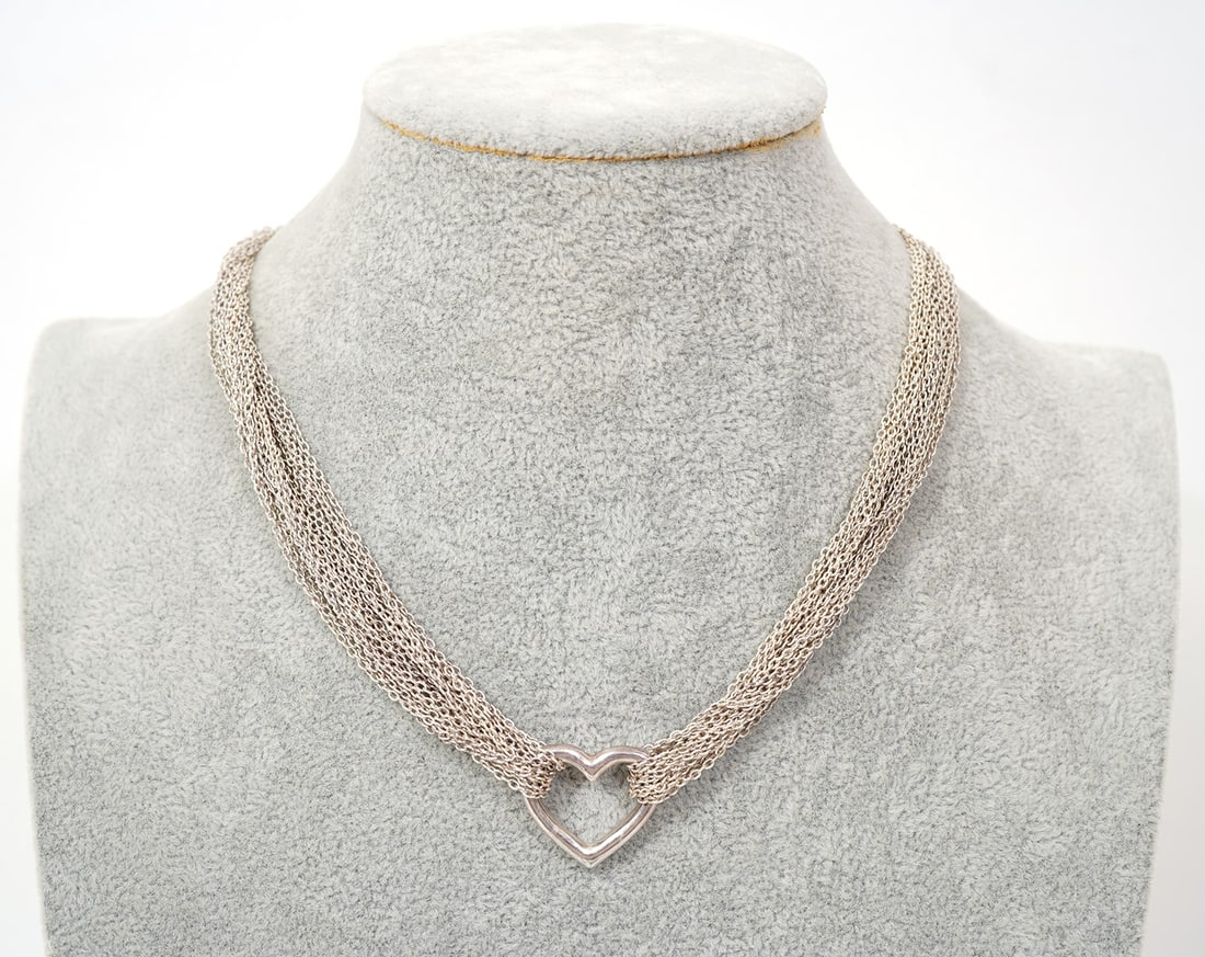 Tiffany & Co Sterling Silver Multi-Strand Necklace: Tiffany & Co sterling silver multi-stand necklace with toggle clasp. Measures 17.5" long and weighs 49.1g. Box is included. Condition report: Good condition, please examine all photos closely. Contact