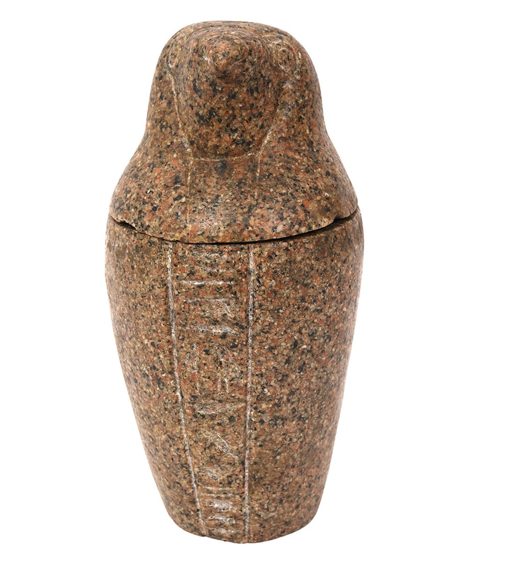 Egyptian Style Stone Canopic Jar: Egyptian style stone canopic jar, likely represents the falcon headed god Horus. Traditionally these jars were used to store mummified organs. Measures 8.25"H x 4"W. Condition report: good condition, 