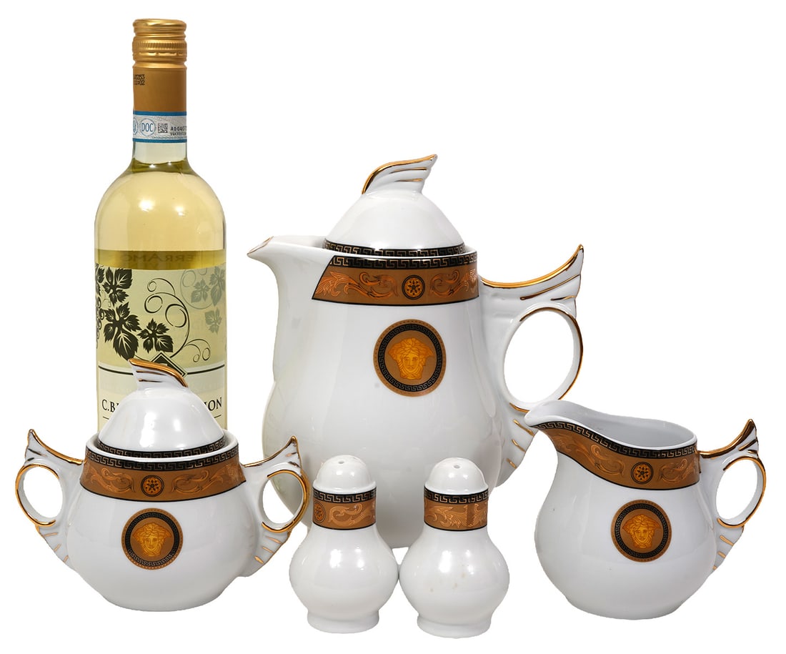 Versace Style Medusa Gold & White China Pieces: Versace Style Medusa Gold and White China pieces includes 1 salt shaker & 1 pepper shaker (3 3/8"H x 2 1/8"W each); creamer (4"H x 5"L x 3.25"W); 1 lidded sugar bowl (5"H x 6"L x 5"W); 1 teapot (9"H x