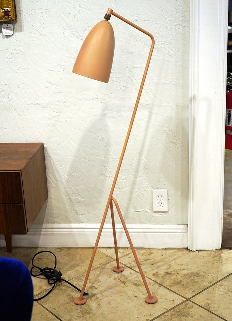 Gubi Grasshopper Floor Lamp: Gubi Grasshopper Floor Lamp in olive brown was originally designed in 1948 by Greta Grossman. Adjustable conical shade is attached on a ball joint for easy movement. Measures 50"H total; 14.5" x 14.5"