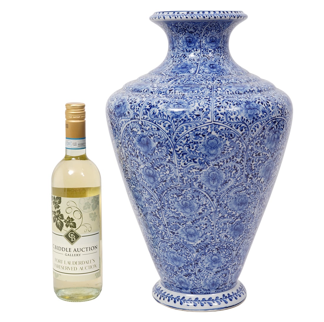 Chinese Blue & White Vase: Chinese blue and white vase decorated overall with intricate floral and lotus patterns. Measures 17"H x 10"W. Condition report: good condition, please see all photos. Contact C. Biddle Auction Gallery