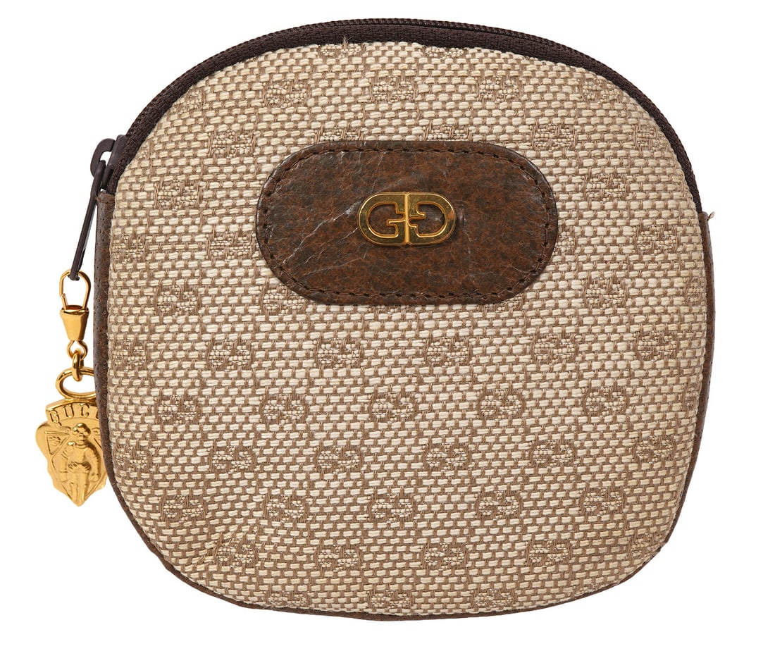 Gucci Micro GG Supreme Pouch with Gold Tone Charm: Gucci Micro GG Supreme pouch with gold tone charm, measures 4.5"H x 4.5"W. Condition report: Common wear from use, please examine all photos closely. Contact C. Biddle Auction Gallery for more detaile
