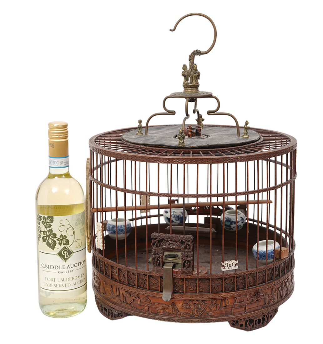 Chinese Bird Cage with Porcelain Bowls & Ornaments: Chinese wood bird cage with porcelain bowls and ornamentation and metal hook with small decorative figures. Measures 18.5"H x 12.5"W. Condition report: Various wear and tear from age and use, please e