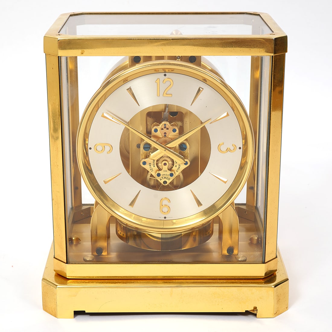 Jaeger-LeCoultre Atmos Perpetual Motion Clock: Jaeger-LeCoultre & Co Atmos perpetual motion brass mantel clock with white patinated clock face. Measures 8.25"L x 6.25"W x 9.25"H. Condition report: Minor external wear and minor oxidation, please ex